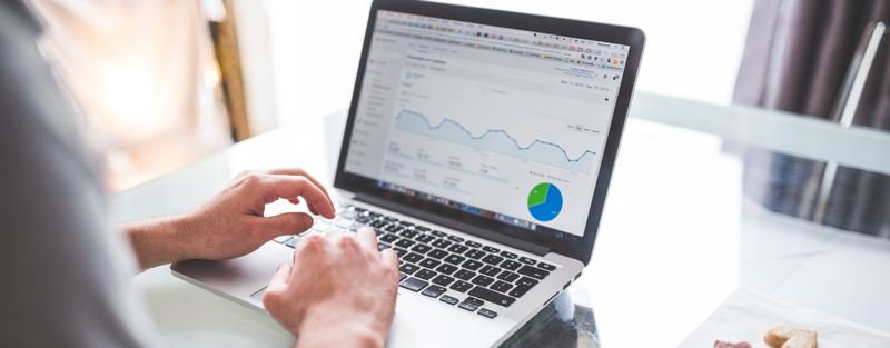 man checking marketing data on computer posted by Coheseo