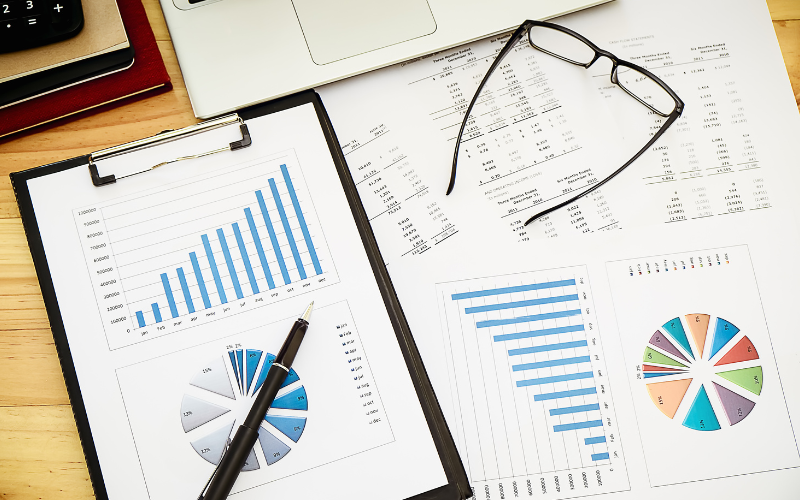 data sheets with eye glasses and a pen scattered on a table posted by Coheseo